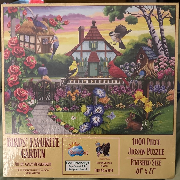 An idyllic garden scene featuring a rustic cottage, a wooden bird feeder, and various birds under a soft sunset sky.
