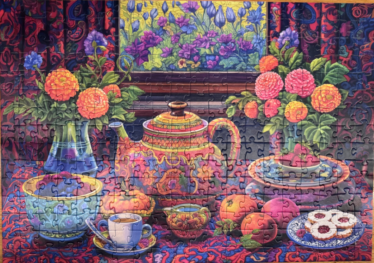 A lush, colorful still life painting of a tea setting with flowers, fruit, and a patterned teapot.