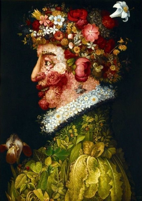 Profile portrait of a man created entirely from flowers, plants, and vegetables against a black background.