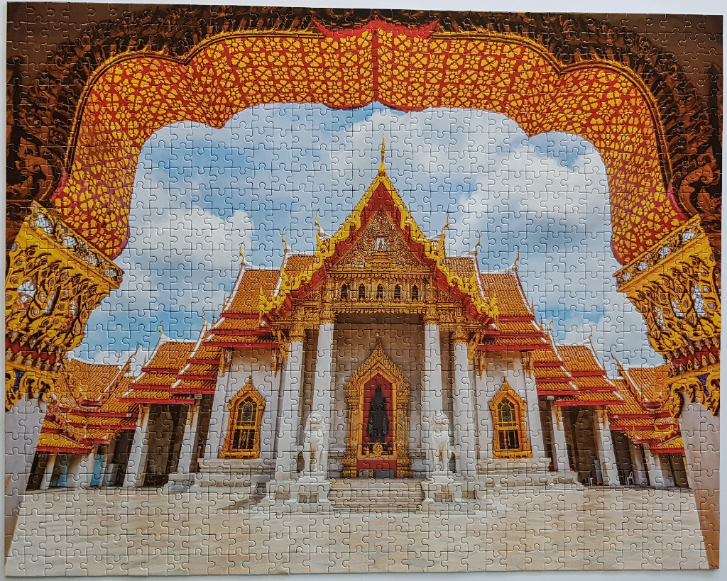 A low-angle, framed view of the Wat Benchamabophit temple in Bangkok, Thailand.