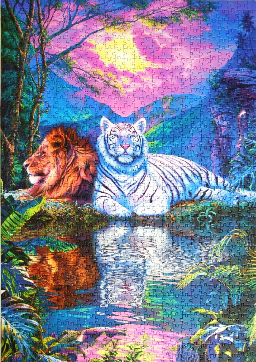 A lion and a white tiger resting side-by-side by a pond beneath a vibrant, colorful sunset sky.
