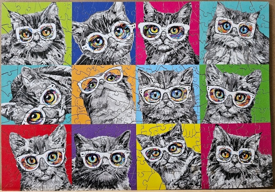 A grid of twelve stylized cat portraits, each wearing white glasses against a brightly colored background.