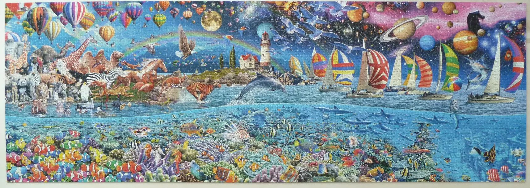 A wide, panoramic illustration showing a fantastical scene with land animals, hot air balloons, sailboats, and a coral reef.