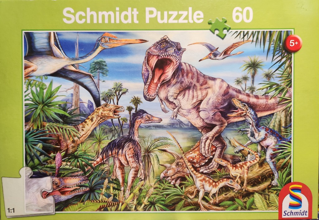 Illustration of various prehistoric dinosaurs in a lush, tropical jungle setting.
