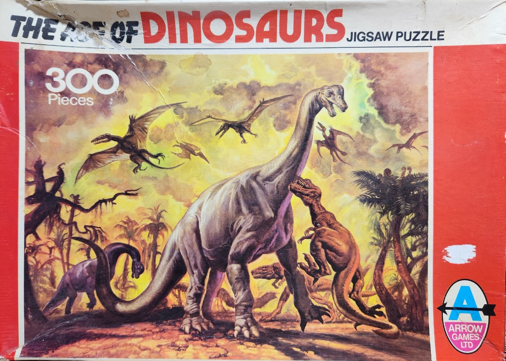 A dramatic prehistoric scene featuring a large sauropod dinosaur being attacked by a predator in a volcanic landscape.