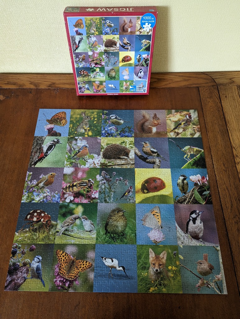 A grid of twenty-five high-quality photographs showcasing British wildlife, including birds, insects, and small mammals.