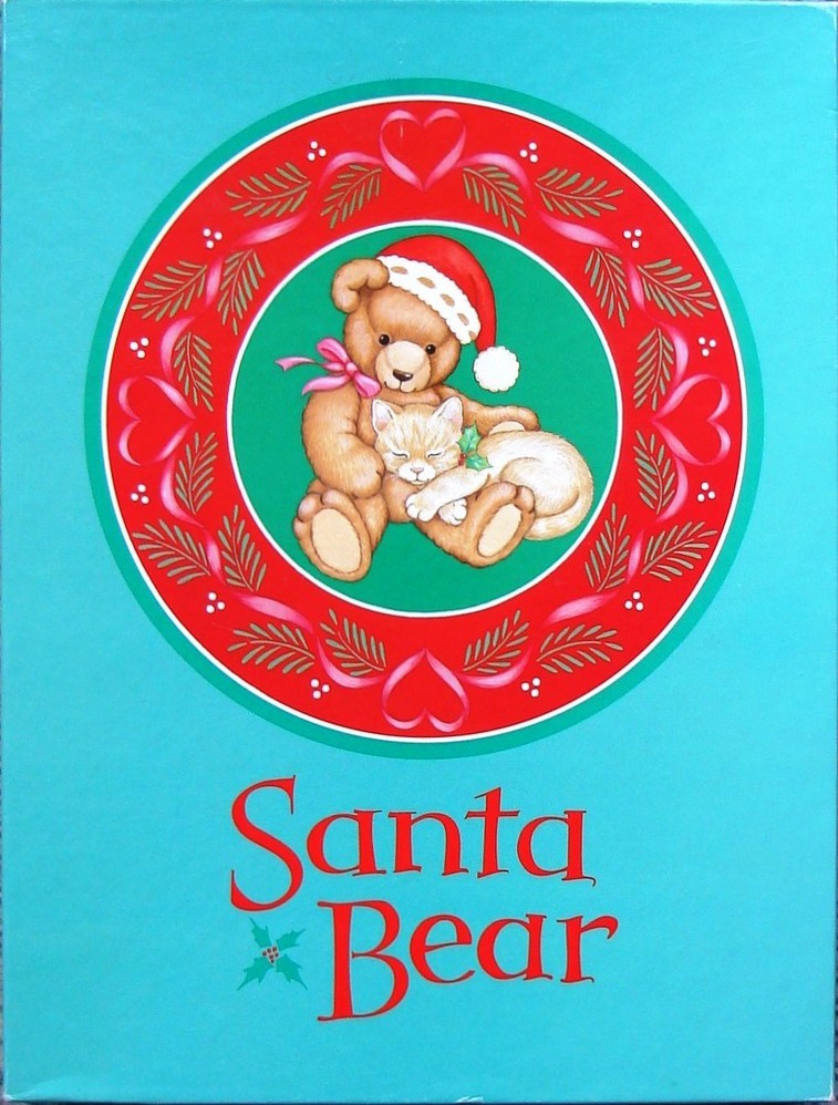 Illustration of a teddy bear wearing a Santa hat cuddling a kitten inside a circular wreath on a turquoise background.