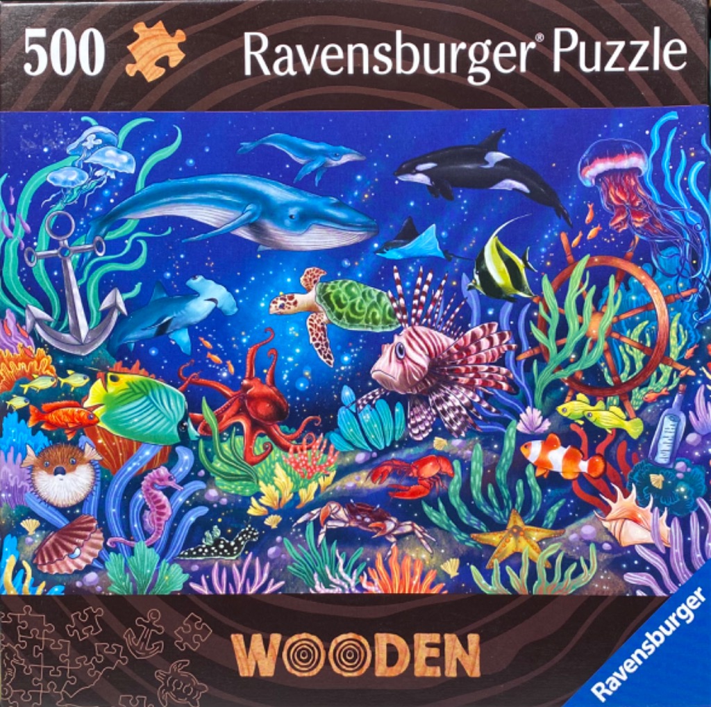 Colorful underwater scene featuring a variety of marine life including a blue whale, sea turtle, and jellyfish.