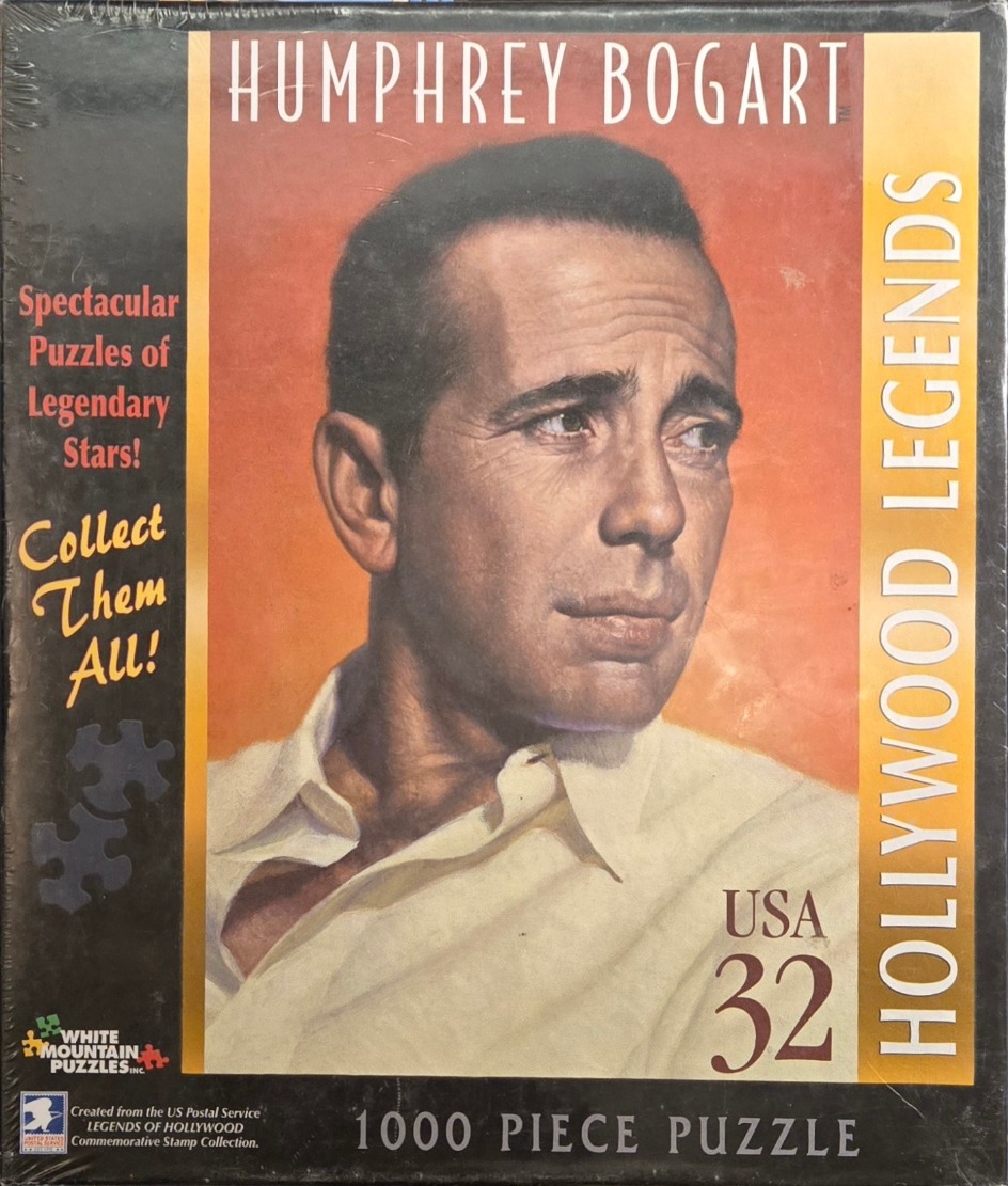 A vintage-style portrait of actor Humphrey Bogart against a warm orange gradient background.