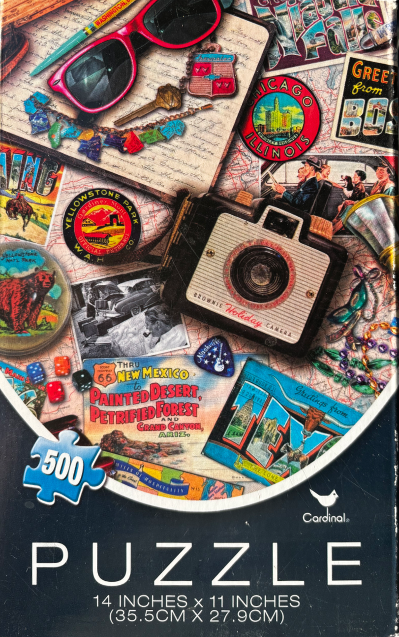 A collage of vintage Americana memorabilia including postcards, an old camera, and sunglasses spread over a map.