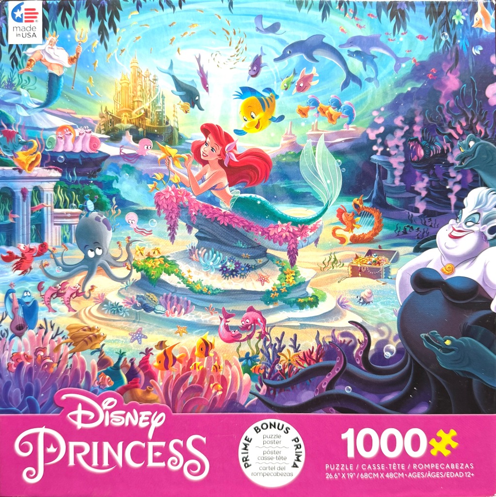 A vibrant underwater illustration featuring Ariel the mermaid surrounded by various ocean characters and a golden palace.