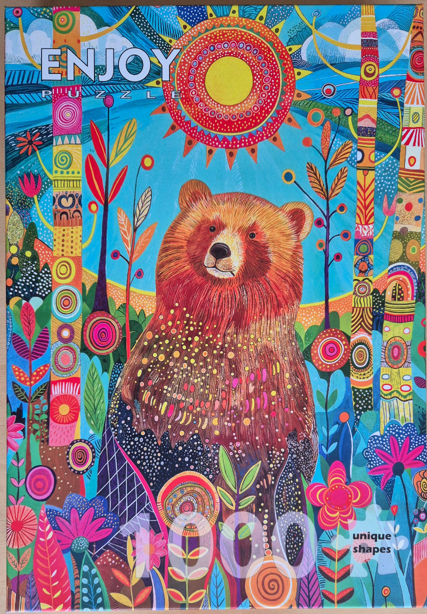 Whimsical, colorful illustration of a bear in a vibrant, patterned forest under a stylized sun.