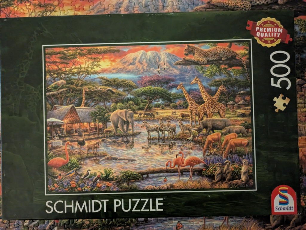 An illustration of an African savanna scene at sunset featuring diverse wildlife and a lodge by a watering hole.