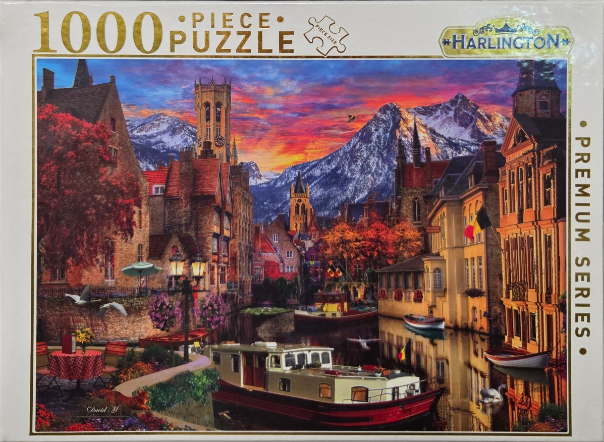 A romantic canal scene in a European city at sunset with mountains in the background.