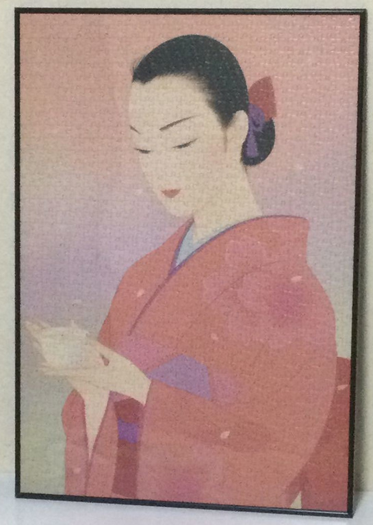 A portrait of a woman in a kimono holding a teacup against a soft, hazy pink background.