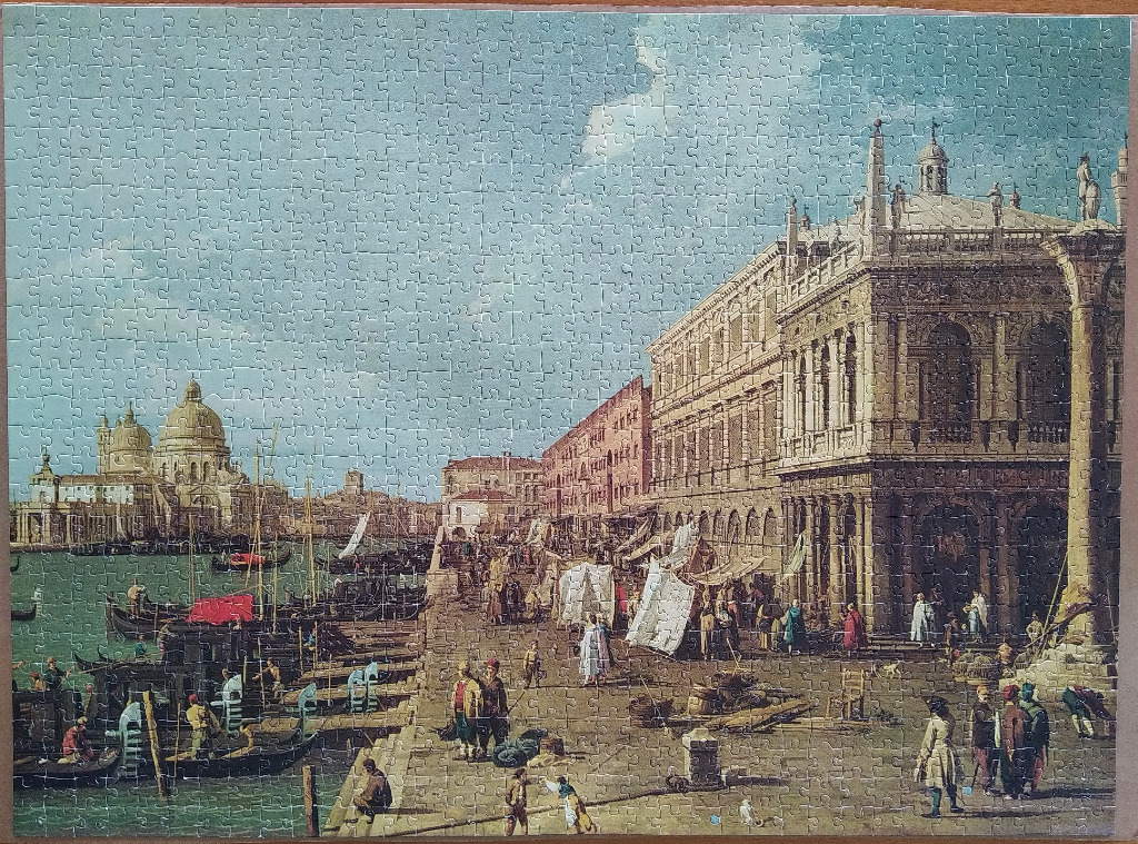 An 18th-century style painting of the Venice waterfront featuring the Piazzetta di San Marco with gondolas and figures.