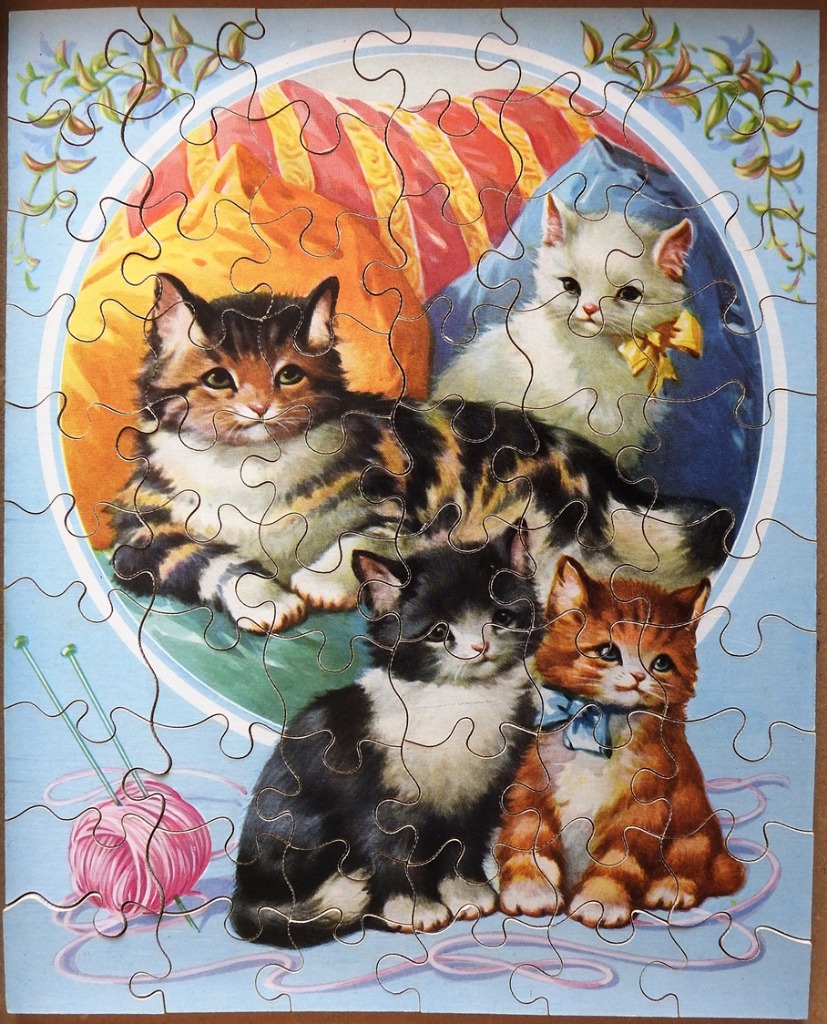 Illustration of four kittens posing with a ball of yarn in a circular frame