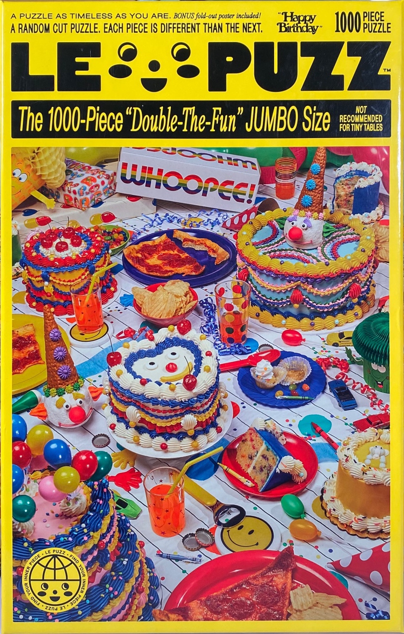 A festive, cluttered birthday party table filled with multiple ornate cakes, pizza slices, and party decorations.