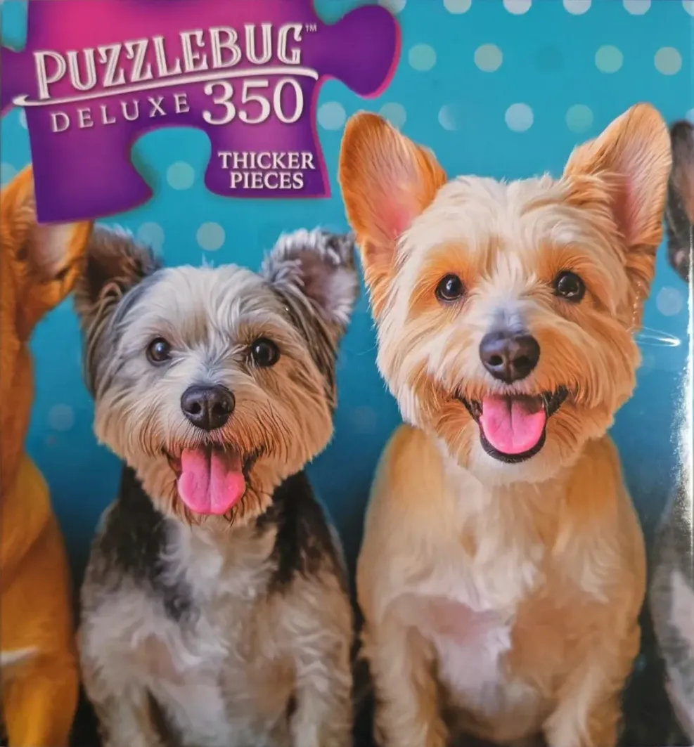 A close-up illustration of three small, happy terrier-type dogs against a blue polka-dot background.