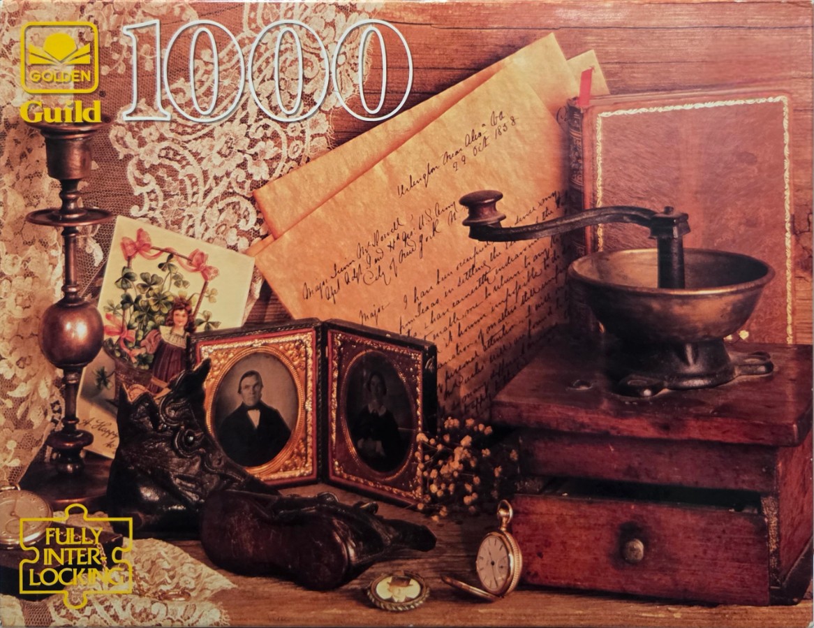 A collection of vintage Americana objects including a coffee grinder, daguerreotypes, and a handwritten letter.