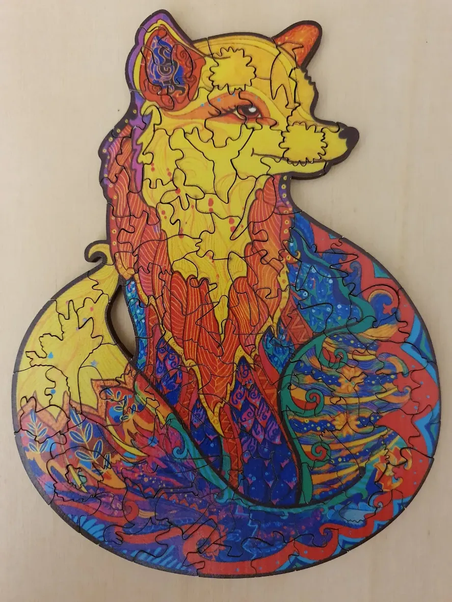 A vibrantly colored, stylised fox illustration with intricate patterns and swirling, psychedelic floral motifs.