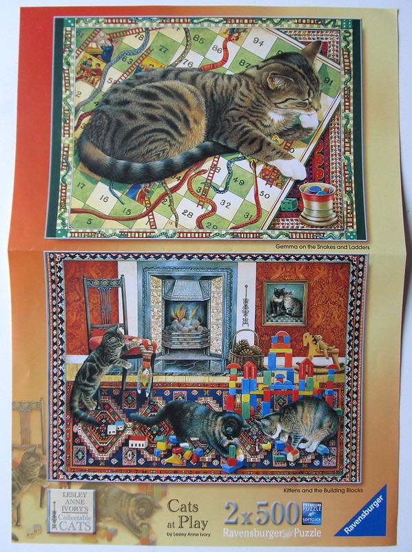 Two separate cat scenes: a tabby cat on a snakes and ladders board and kittens playing with blocks by a fireplace.