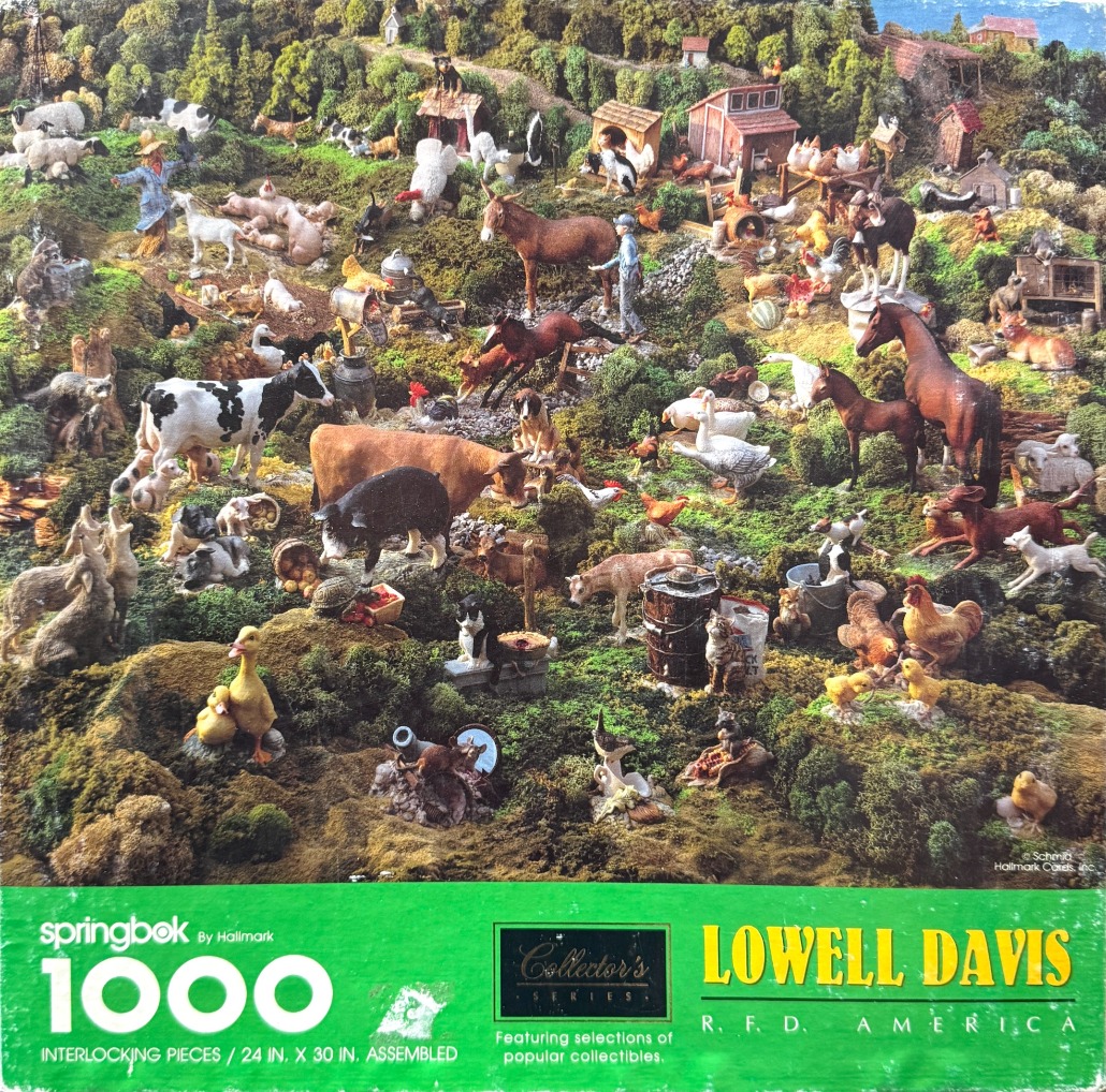 A densely populated rural farm diorama featuring many miniature animal figurines, barns, and rolling green hills.