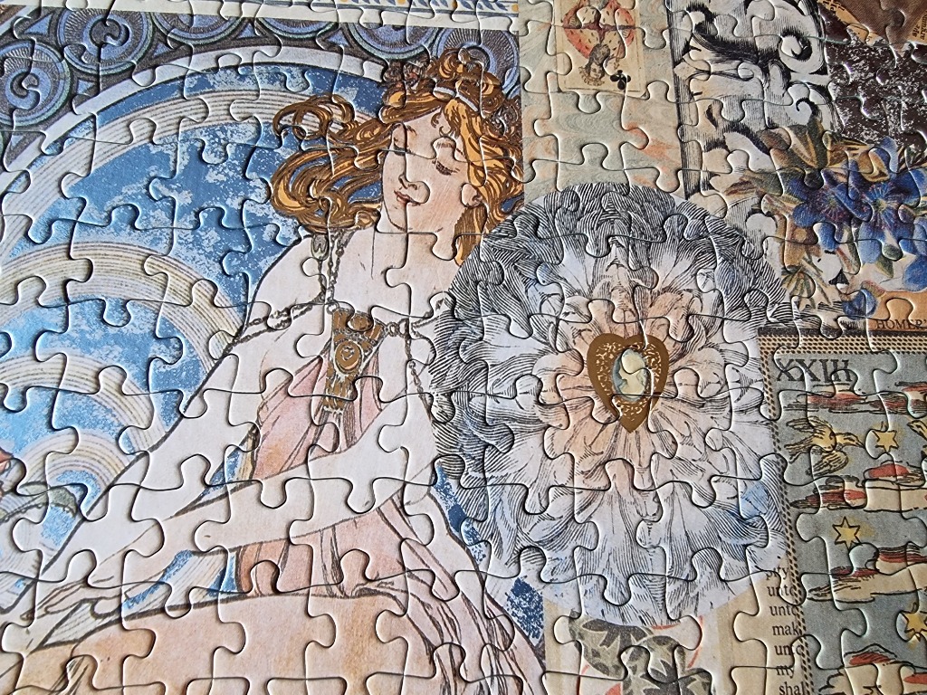 An Art Nouveau style illustration of a woman with flowing red hair surrounded by vintage ephemera and a decorative mandala.