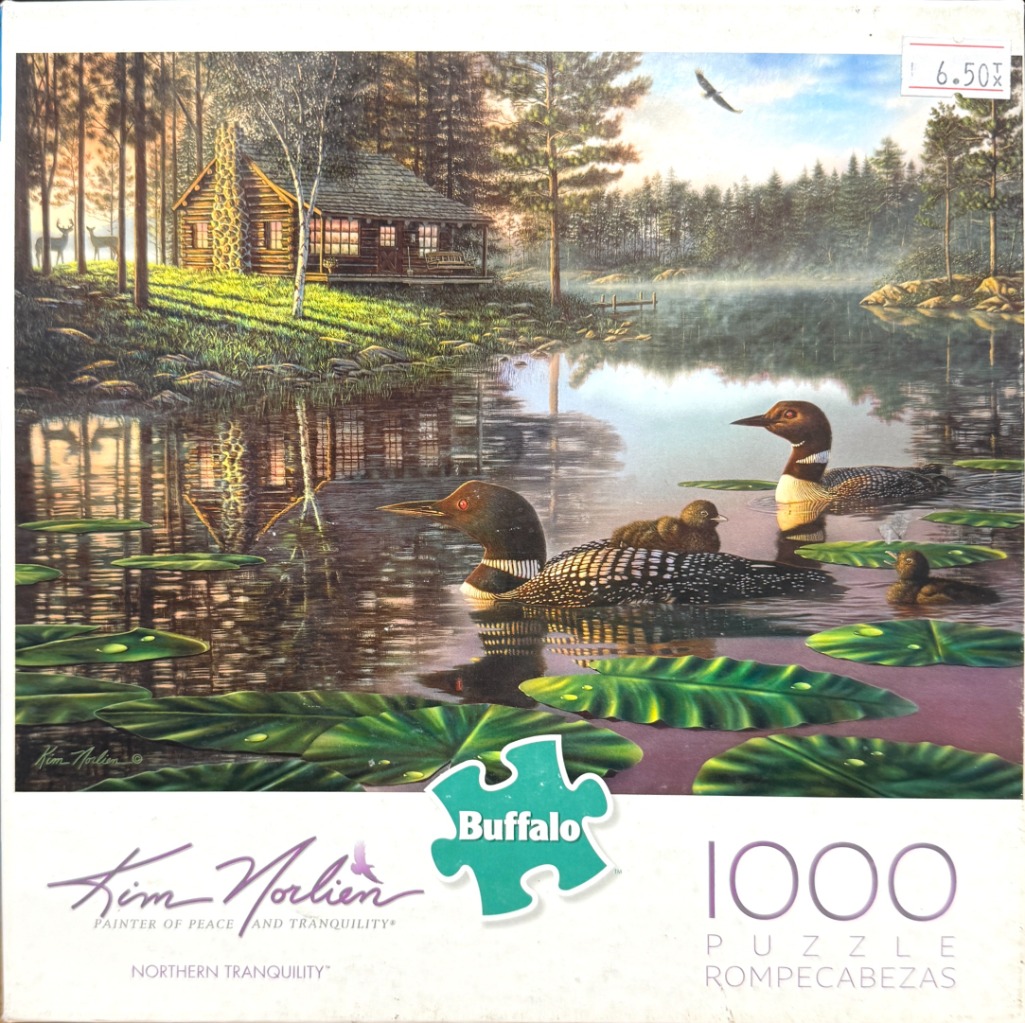 A peaceful lakeside scene with a log cabin, loons, and deer in a forest at sunset.