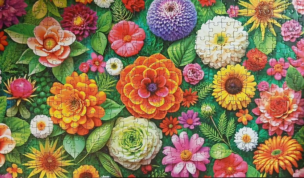 A lush, vibrant garden scene filled with a variety of colorful flowers in full bloom.