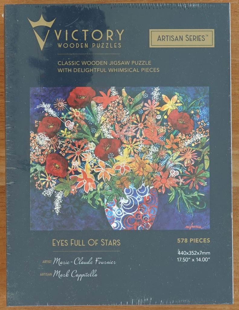 Artistic floral arrangement in a patterned vase by Marie-Claude Fournier