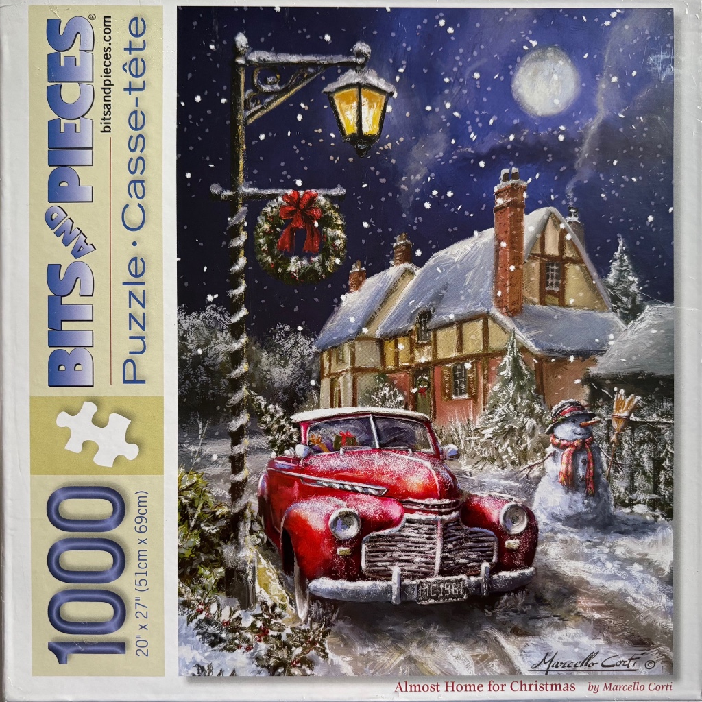 A vintage red car parked in front of a snowy cottage under a full moon and streetlamp.