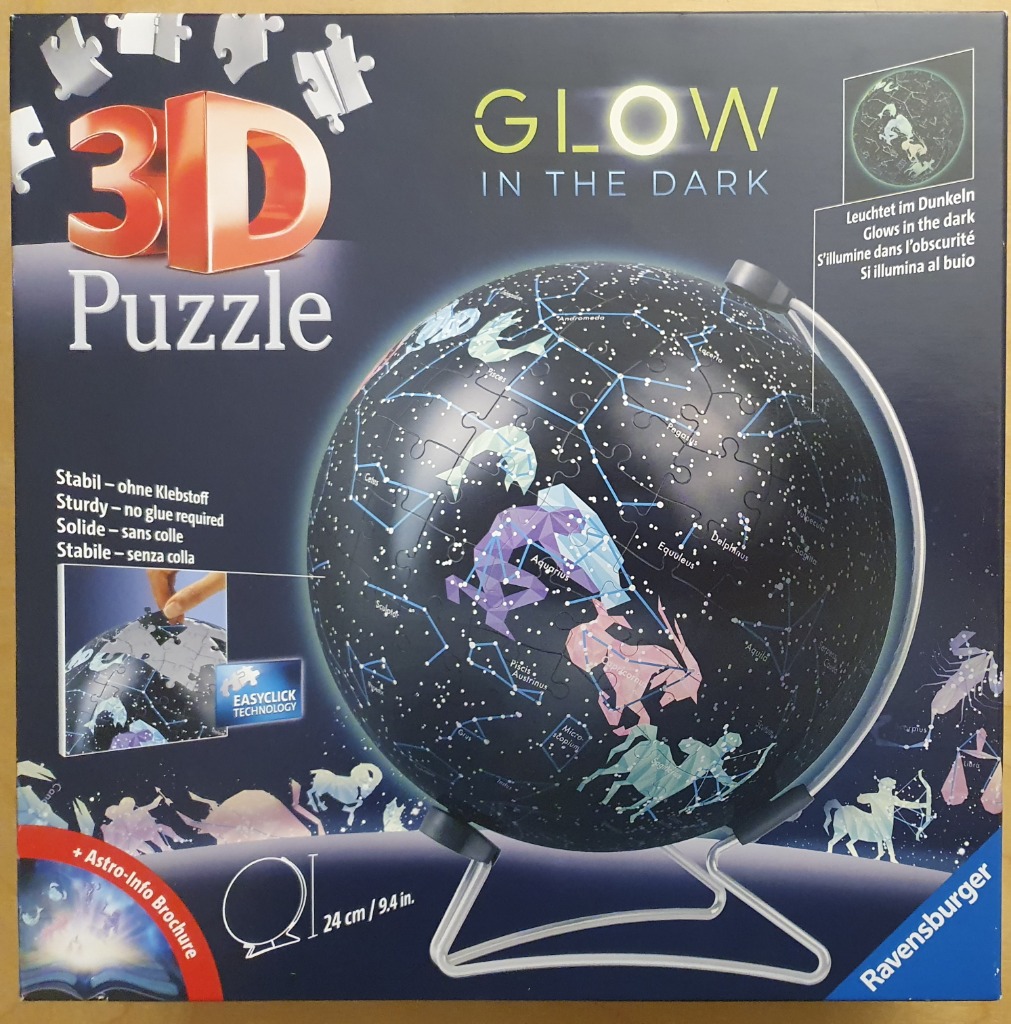 A spherical globe featuring a detailed map of the night sky with glowing constellations.