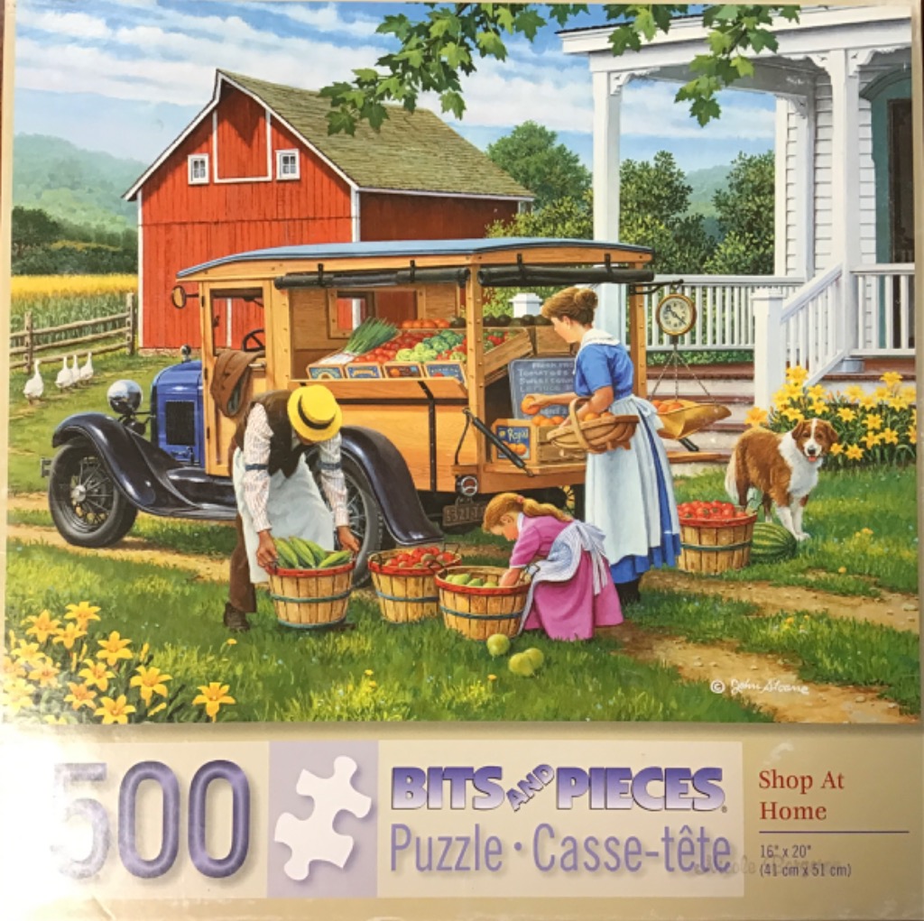A family selling fresh produce from an antique truck in front of a red barn and farmhouse.