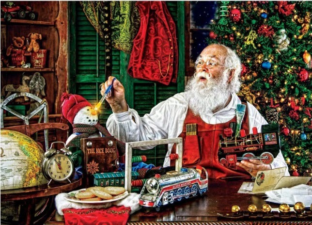Santa Claus painting a snowman's nose in a cozy, toy-filled workshop.