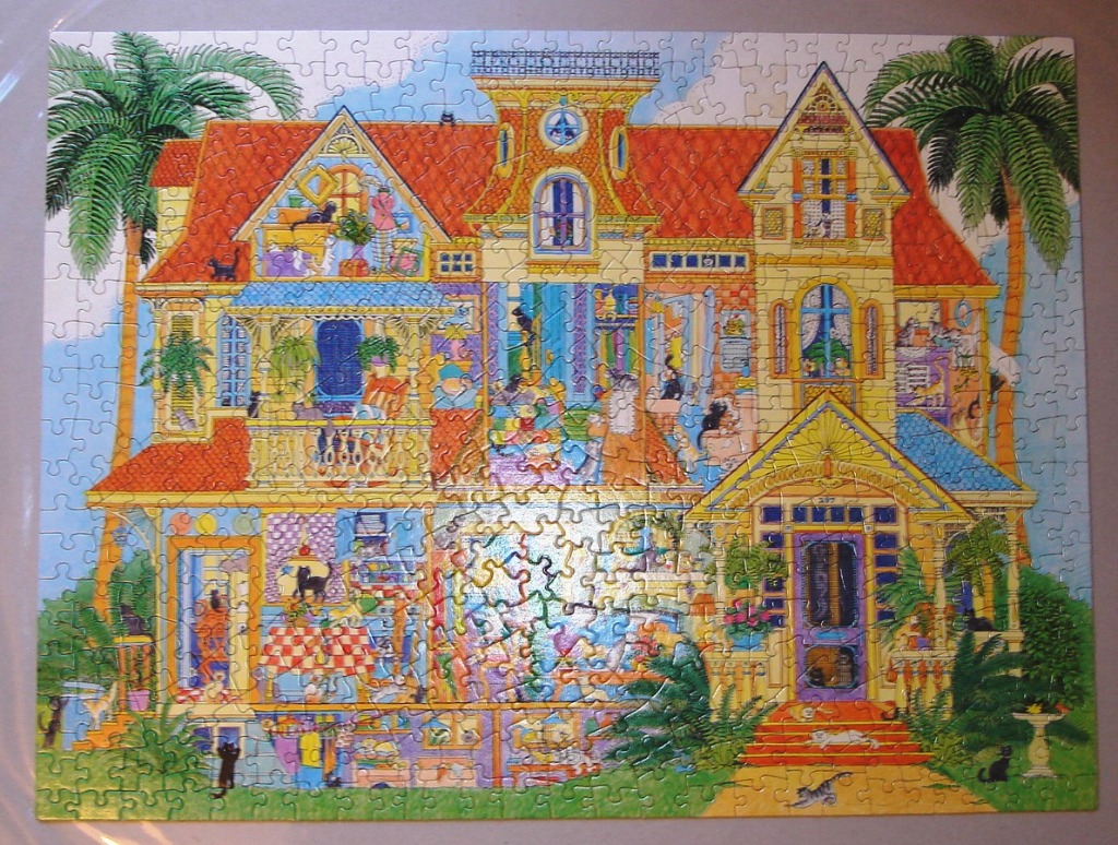 A whimsical illustration of a yellow Victorian house filled with dozens of cats.