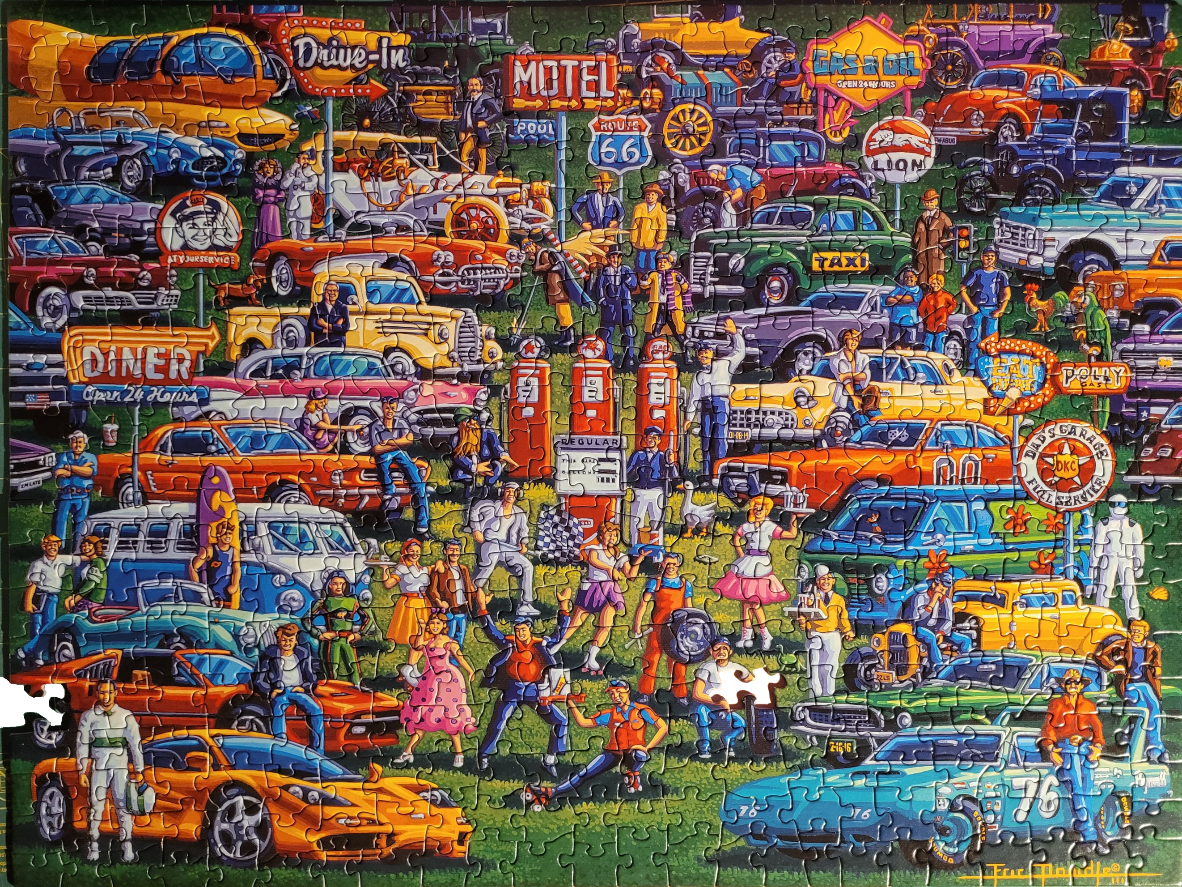 A crowded 1950s-style retro scene featuring many vintage cars, a diner, and people in period clothing.