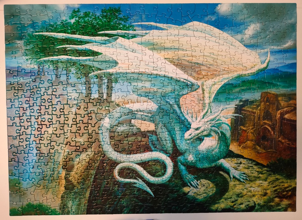 A majestic white and teal dragon with large wings perched on a cliffside before ancient ruins.