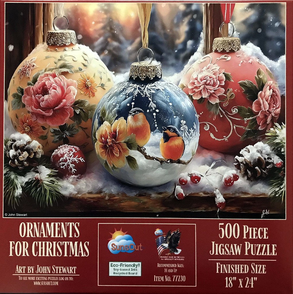 Three hand-painted Christmas ornaments resting on a snowy windowsill against a blurred winter backdrop.