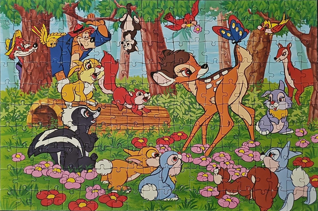 A colourful cartoon illustration featuring Bambi surrounded by forest animal friends including a skunk, rabbits, and birds.
