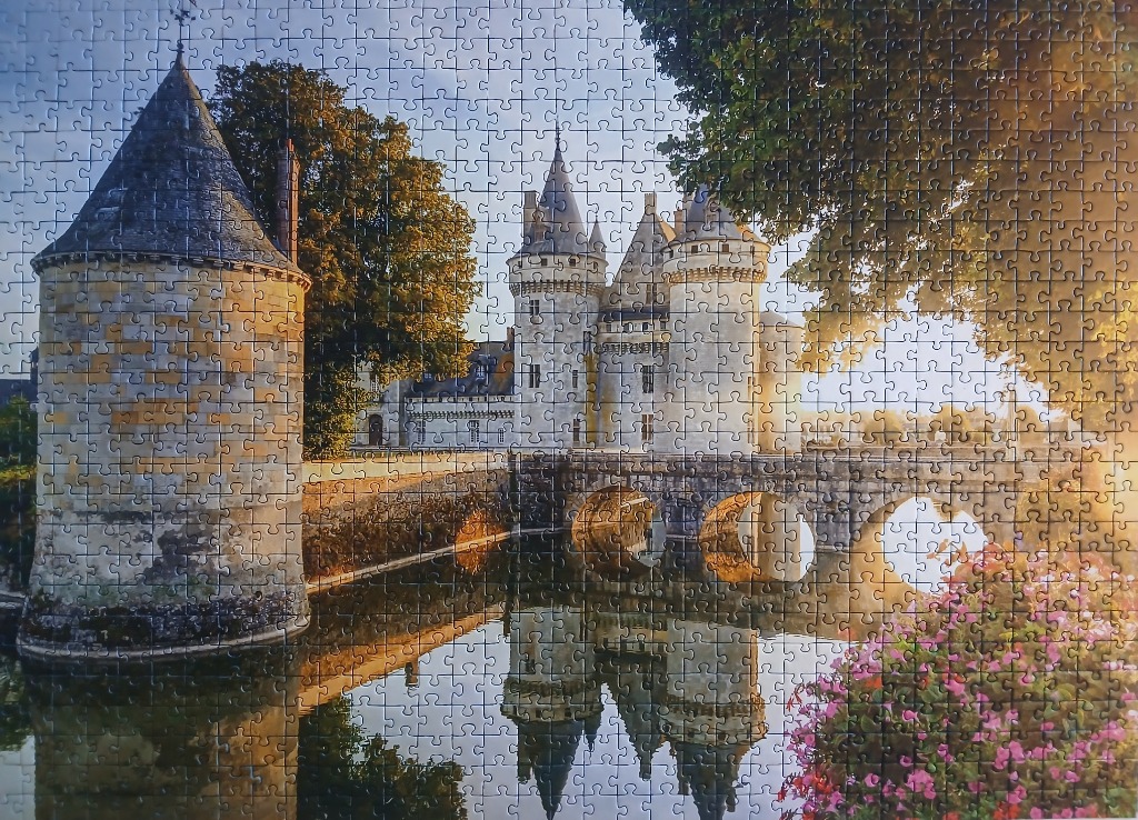 Château de Sully-sur-Loire reflected in a moat at sunset