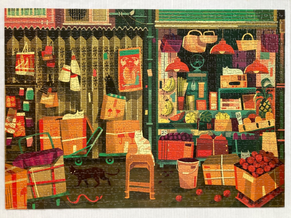 An illustration of a bustling produce shop with cats and boxes, rendered in a warm, artistic style.
