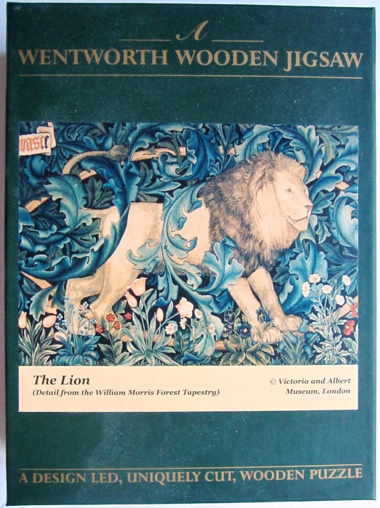 A section of the William Morris Forest Tapestry featuring a lion surrounded by stylized blue leaves and flowers.