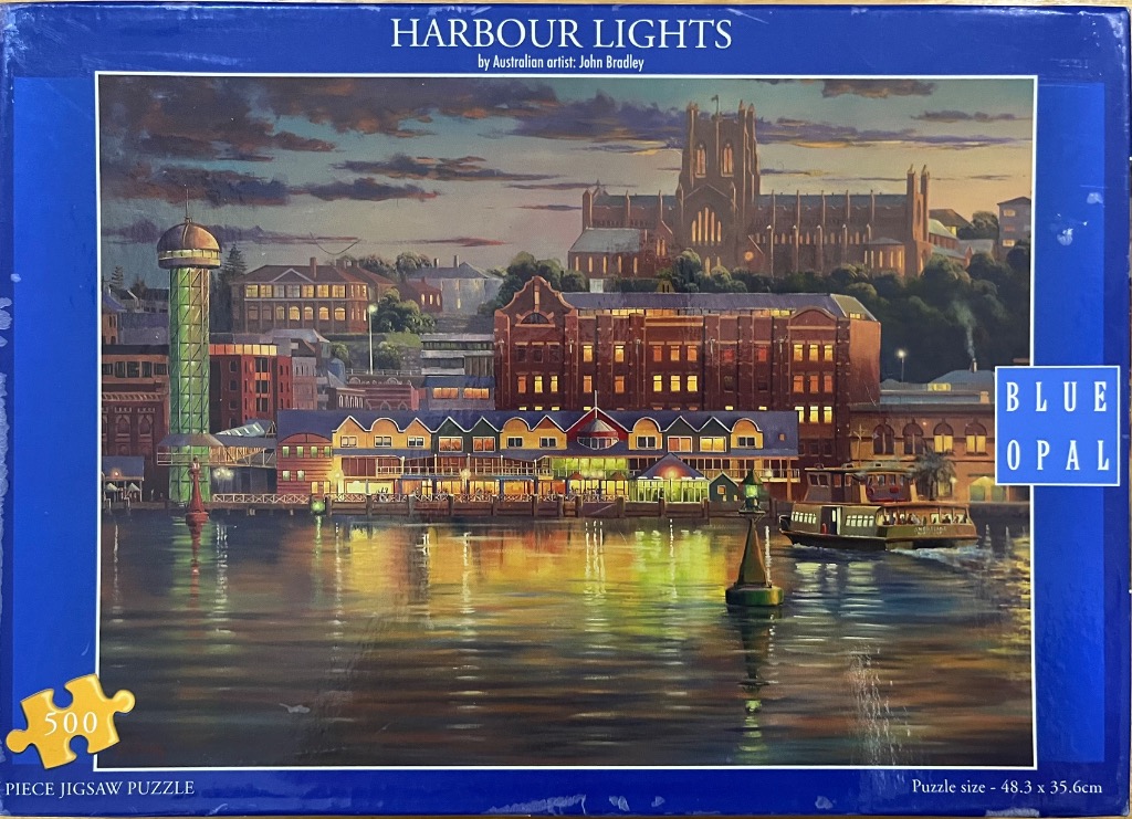 A twilight harbour scene with city buildings, a church, and reflections on the water, by John Bradley.