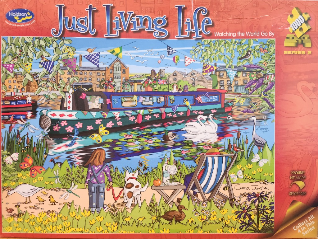 A cartoon-style scene of a colourful canal boat with a woman and dog relaxing by the water.