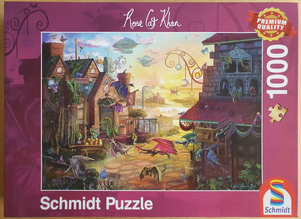 Fantasy illustration of a dragon-filled village street at sunset with airships in the sky.