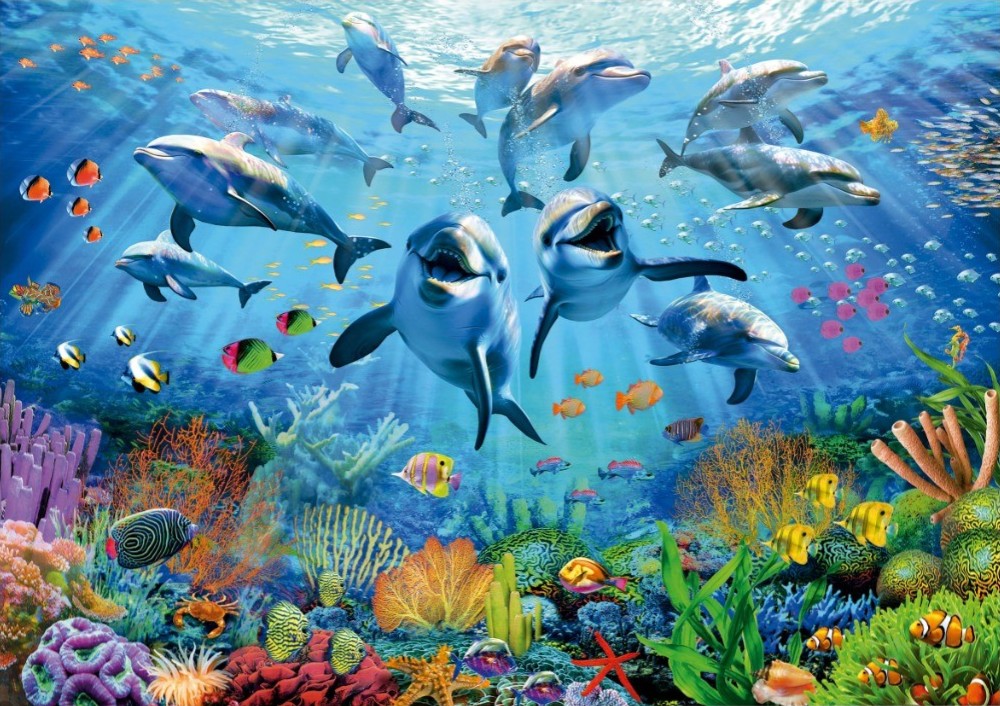 A vibrant underwater scene featuring a pod of dolphins swimming above a colorful coral reef teeming with tropical fish.