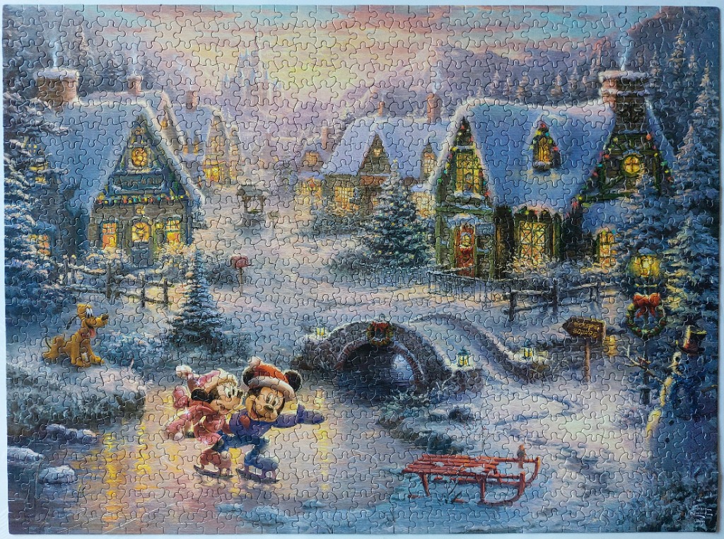 Mickey and Minnie Mouse ice skating in a snowy village scene