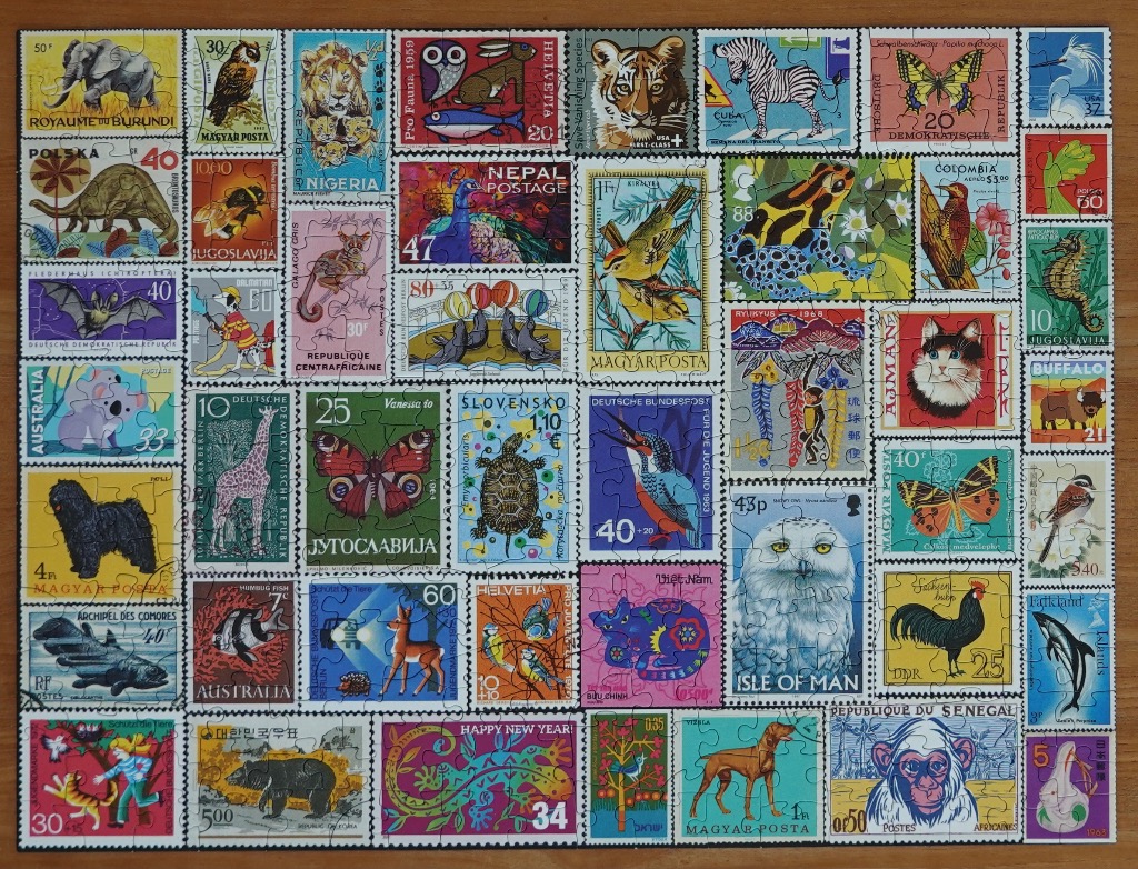 A collage of diverse vintage postage stamps featuring animals, insects, and wildlife from around the world.