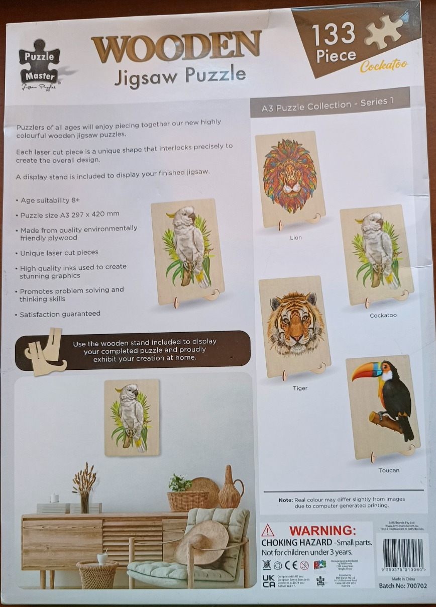 A collection of artistic animal portraits including a lion, tiger, toucan, and cockatoo printed on wooden panels.